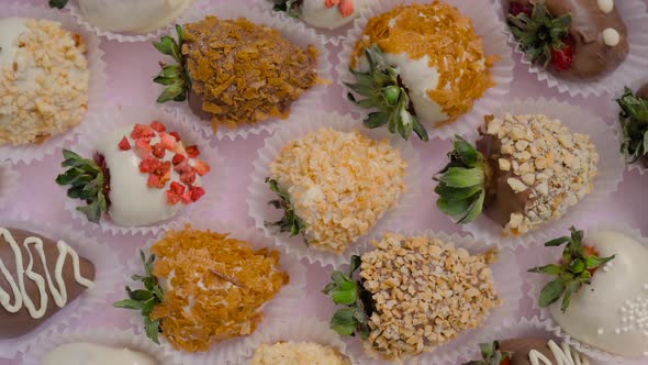 Many Chocolate Covered Strawberries on Rotating Surface Close Up Top View