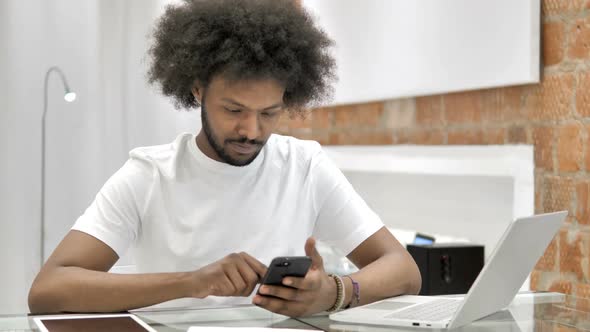 African Man Using Smartphone