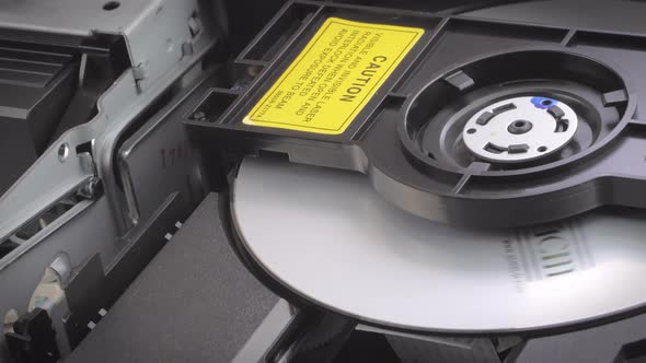 Closeup Shot of a Dvd Being Inserted Into a Dvd Player