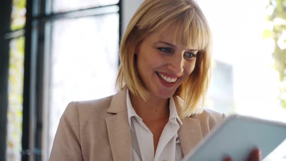 Businesswoman using tablet at office