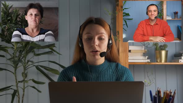 A Young Woman is Talking on a Video Call with a Young Man and a Woman