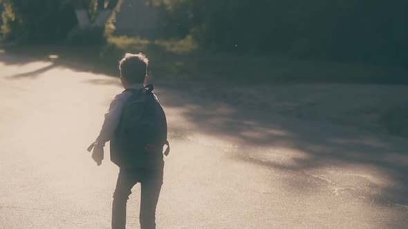 Young Guy Jumps Throwing White Paper Sheets and Skips School