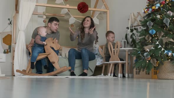 Young Family Enjoying Christmas Holidays at Home