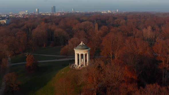 Epic Scenic Aerial Slide Circle Around The Monopteros in English Garden in Munich, Germany