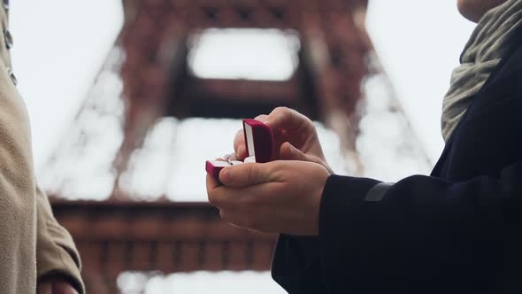 Lover Making Marriage Proposal to His Beloved Girl on Background of Eiffel Tower