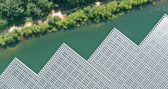 Aerial View Renewable Energy Technology in Solar Panels Floating in Pond