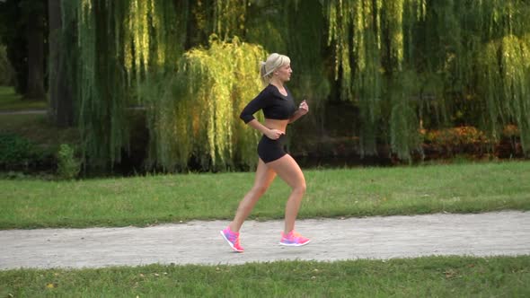 Woman Runner Running in the Park, Slow Motion