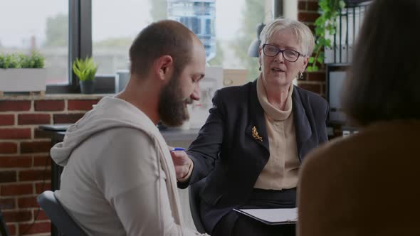 Woman Therapist Giving Advice and Guidance to People with Mental Health Issues at Aa Meeting