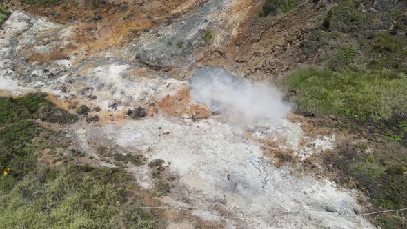 Aerial view of vulcano crater with sulfur vapor coming out of the sulfur marsh.