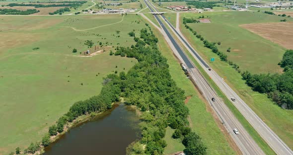 Oil Pump in the Countryside the Small Pond Near Historic Road 66 in Clinton Oklahoma on Aerial View