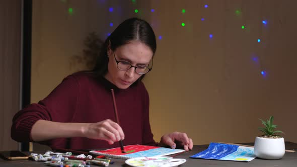 Woman Draws Picture Sitting at Home