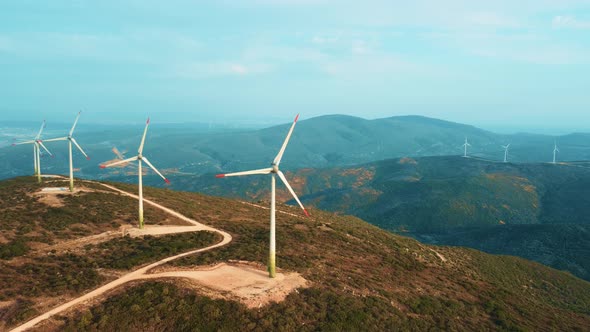 Drone Flies Over a Windmill Park