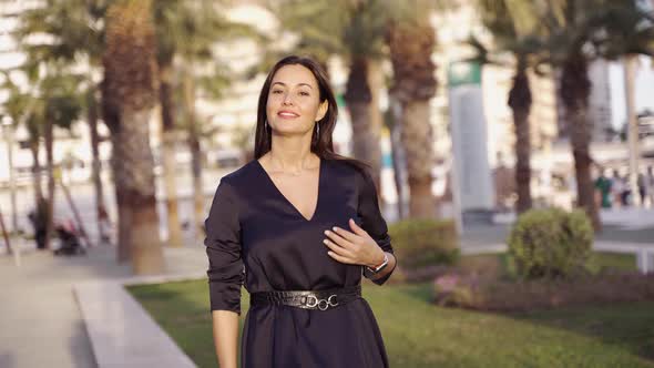 Smiling Hispanic Female Looking at Camera