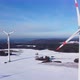 Aerial view of a wind farm. Flying past a rotating wind turbine. - VideoHive Item for Sale