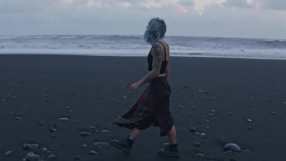 Cool Girl Walking On Black Beach