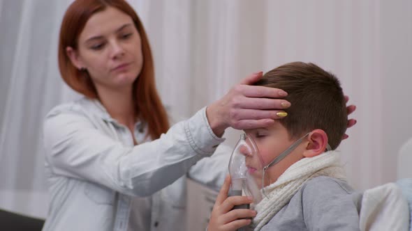 Mother Worries About the Health of Her Male Child with Symptoms of Pneumonia and Helps Her Son