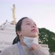 Close up of Asian woman standing and taking deep  breath at park - VideoHive Item for Sale