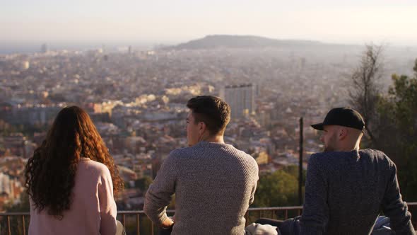 Three friends at a lookout point in Barcelona