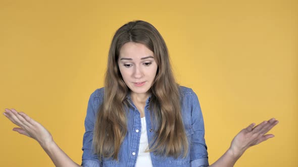 Pretty Woman with Frustration and Anger Isolated on Yellow Background