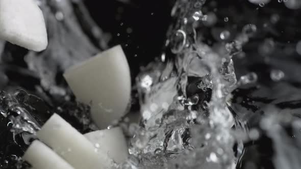 Throwing cut Chinese radish into boiled water. Slow Motion.