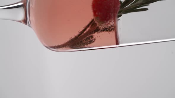 Vertical video, Close-up of sparkling champagne being poured into a glass; bubbles in a glass