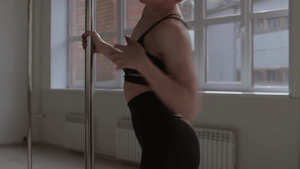 Fit Woman Dancing Erotic Dance in Studio