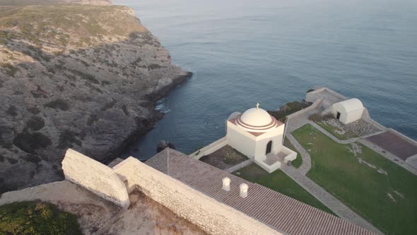 Walled fort of Santo Antonio de Belixe overlooking Atlantic sea and limestone cliffs, Algarve.