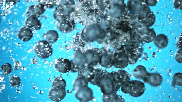 Super Slow Motion Shot of Flying and Splashing Fresh Blueberries at 1000Fps.