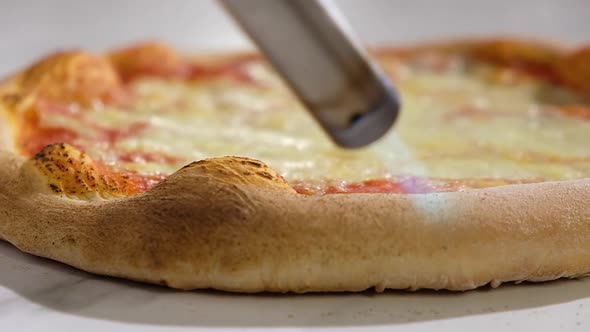 Preparation of national traditional Italian pizza with crust