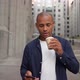 Confident Ethnic Man Drinking Hot Beverage and Using Smartphone - VideoHive Item for Sale