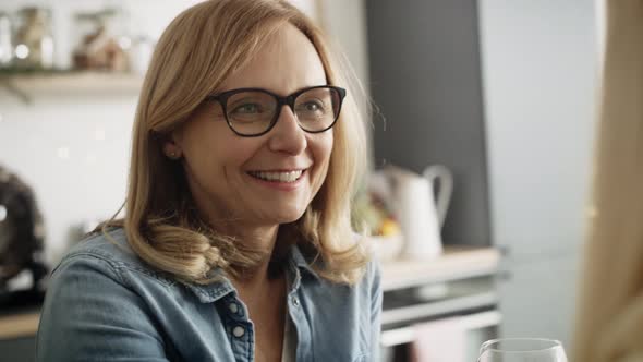 Close up video of woman drinking wine at home. Shot with RED helium camera in 8K.