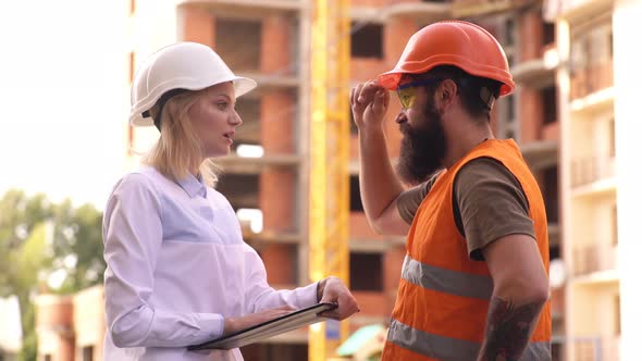The Construction Manager Controls the Work Process in the Construction Industry. A Female Engineer