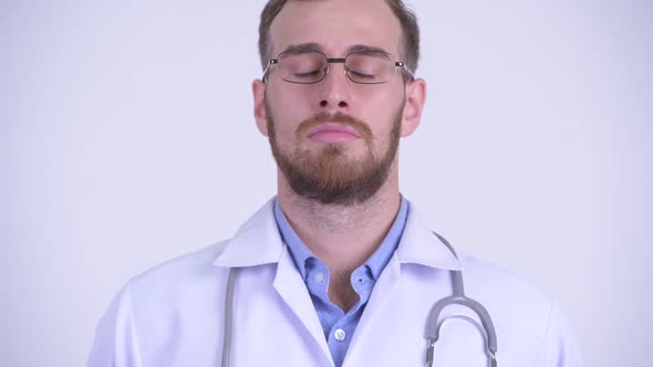 Face of Happy Bearded Man Doctor Relaxing with Eyes Closed