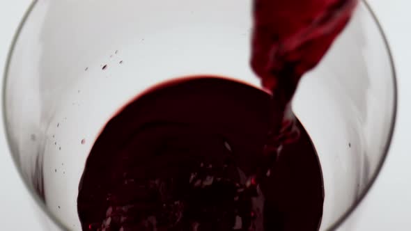 Red Wine Pouring Glass Closeup