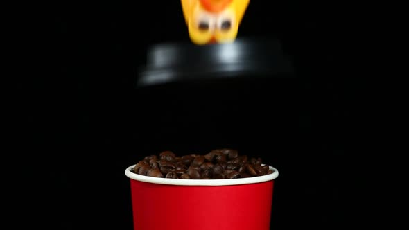 footage of coffee cup rubber chicken dark background