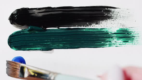 Brush Drawing with Colorful Paint Closeup Black Green and Blue Colours Art Concept