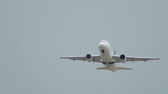 A Closeup of an Airplane Taking Off in the Mountains Into the Sky