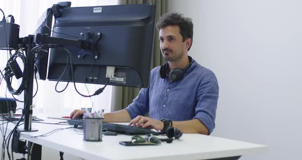 Programmer Working on Computer in IT Office Typing Data Coding in Software