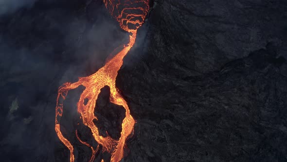 Lava flowing from the mouth of the volcano Iceland