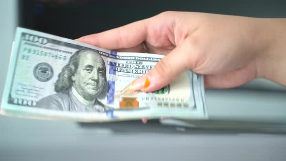 Woman Counting American Dollars 4K