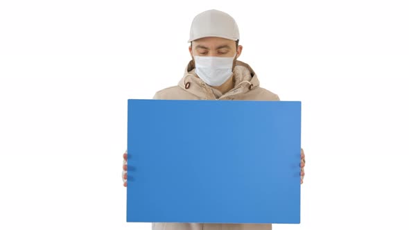 Casual Man with Copy Space Billboard Wearing Protective Mask on White Background