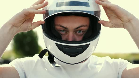 Attractive Man Sititng in a Gocart on the Track