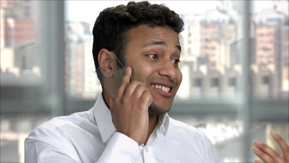 Happy Indian Man Talking on Blank Transparent Phone