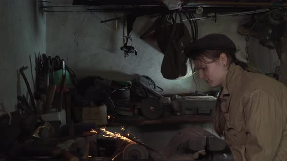 A Girl Works in an Old Home Workshop