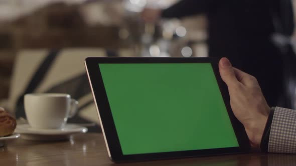 Real Shot In Cafe Of Man Operating Tablet Green Screen