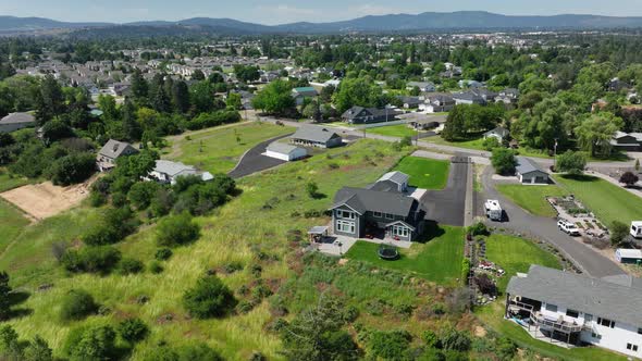 Wide shot of expensive homes on acres of land in upper class America.