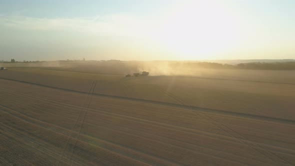 Top Down View of Harvester Machine Working in Wheat Field . Combine Agriculture Machine Harvesting