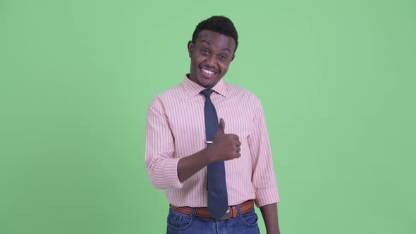 Happy Young African Businessman Giving Thumbs Up