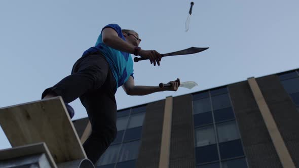 Juggler ends his routine juggling knives