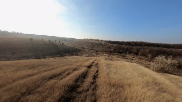 FPV Flight Over the Hills on a Sunny Autumn Day